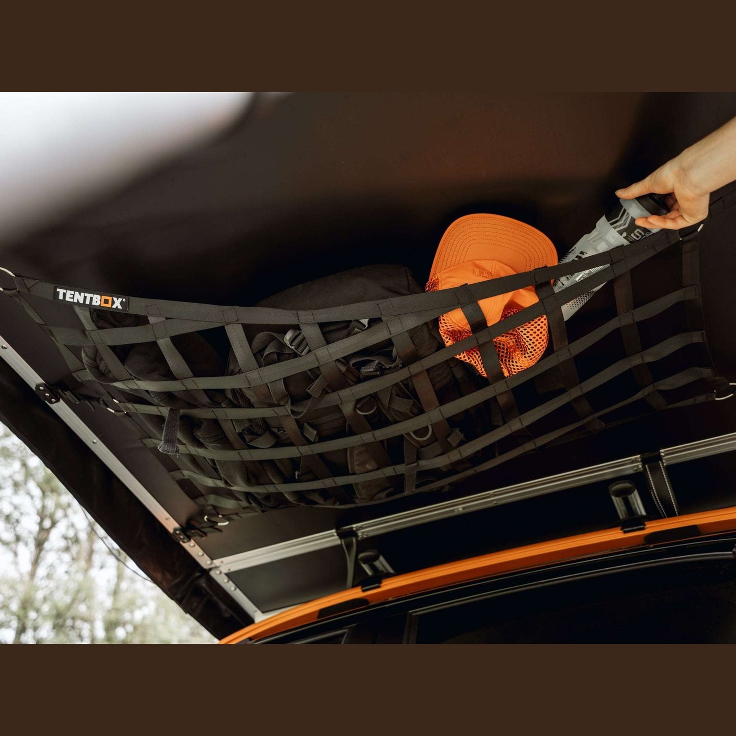 Lite 2.0 Storage Web (Lite 2.0) This storage web easily attaches to the fold-out section of your Lite 2.0, offering a convenient solution for hanging clothes, gear, or lighting. Once installed, it can remain in place when you close your TentBox, ready for