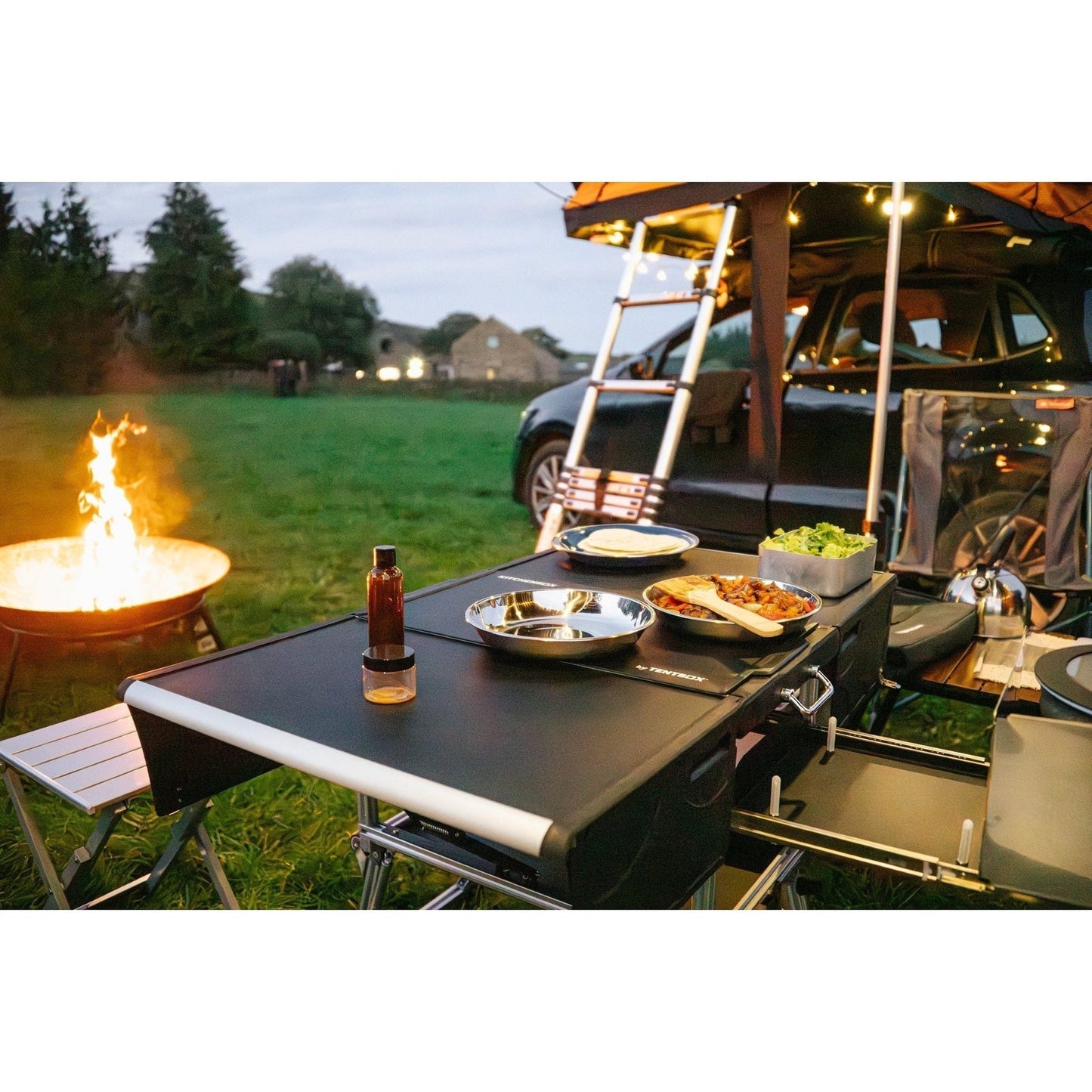 KitchenBox - Complete Camp Kitchen, Includes Stove, Chairs and Cooking Utensils The KitchenBox is a hassle-free kitchen built into a compact box. Easy to carry and designed to fit in your car boot, it sets up in seconds and includes everything you need to