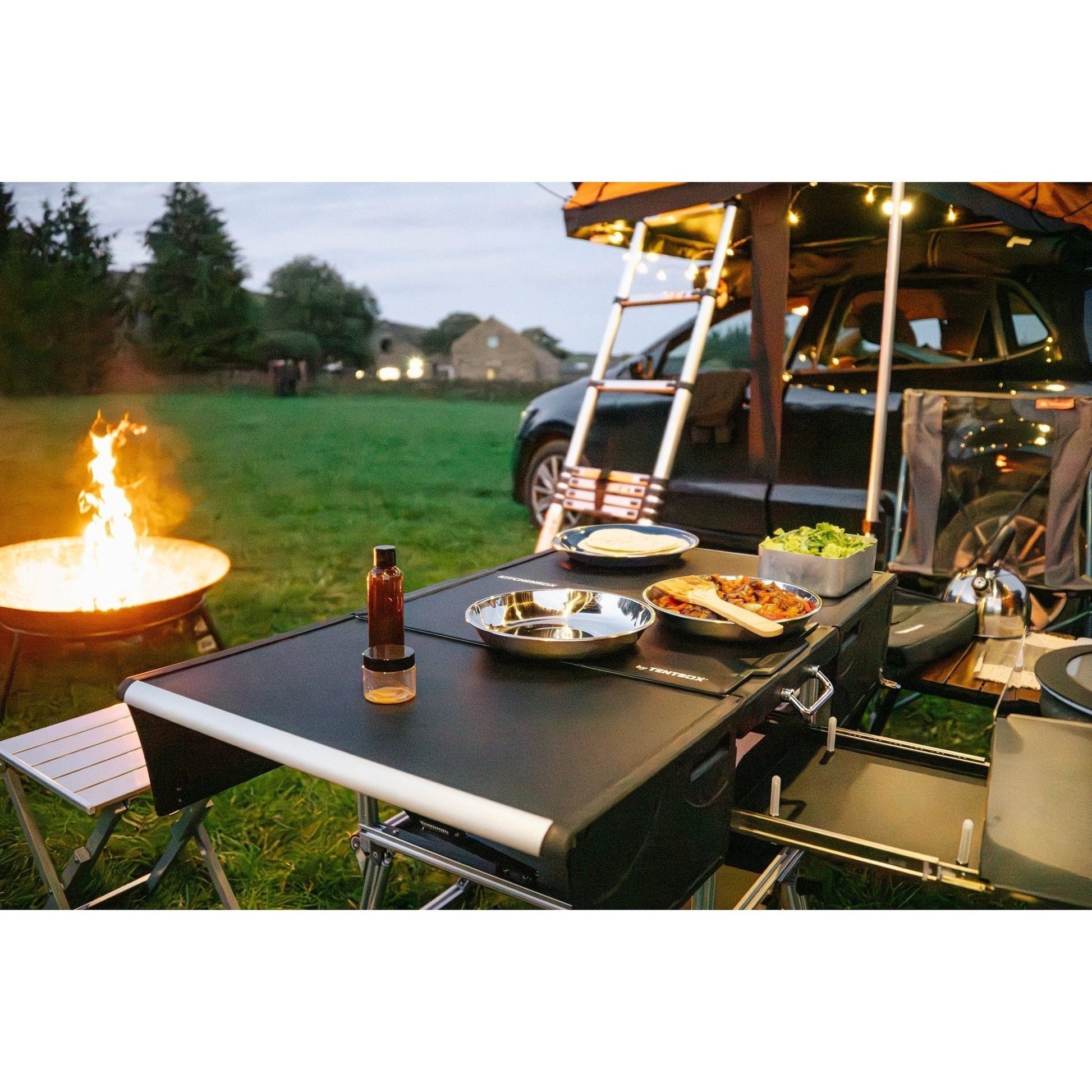 KitchenBox - Complete Camp Kitchen, Includes Stove, Chairs and Cooking Utensils The KitchenBox is a hassle-free kitchen built into a compact box. Easy to carry and designed to fit in your car boot, it sets up in seconds and includes everything you need to